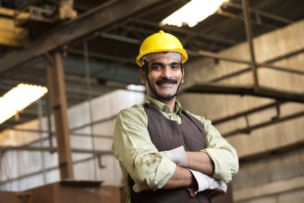 istock Confident industrial worker in protective workwear at factory 1272131690