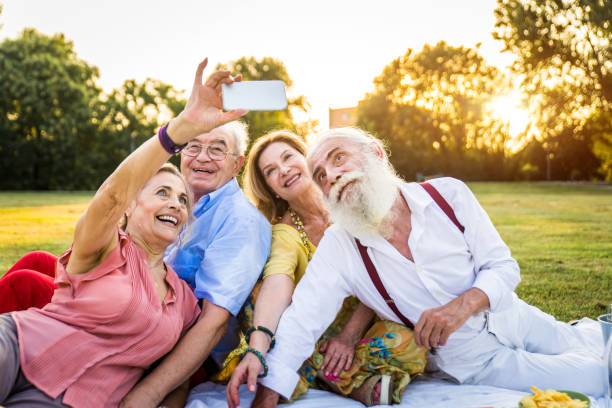 istock Group of senior people bonding outdoors 1272132829