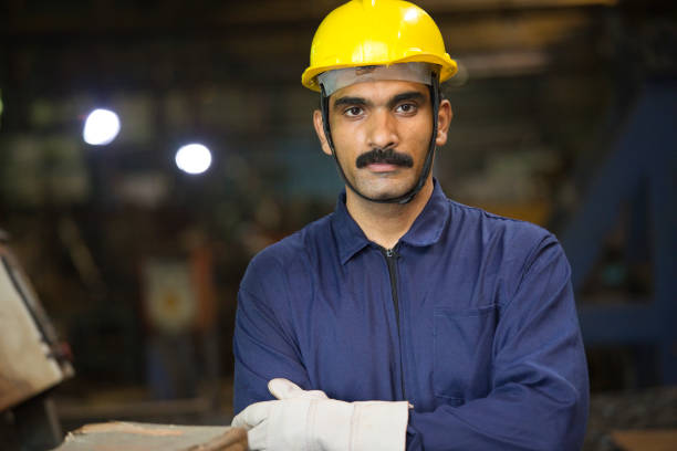 istock Confident industrial worker in protective workwear at factory 1272135089