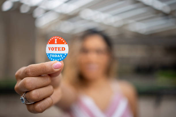 istock Young Hispanic Woman with I voted Sticker 1272135187