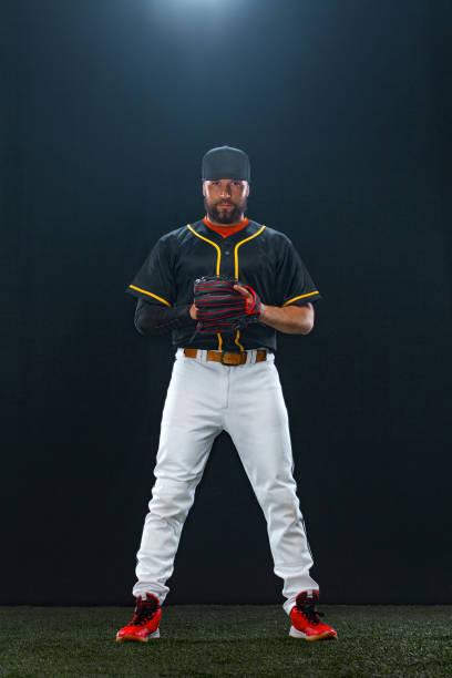 istock Baseball player on dark background. Ballplayer portrait. 1272135788
