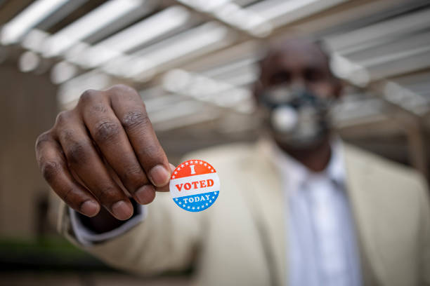 istock Young Black Man with I voted Sticker 1272135881