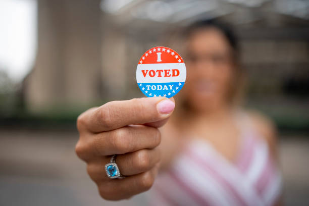 istock Young Hispanic Woman with I voted Sticker 1272135921