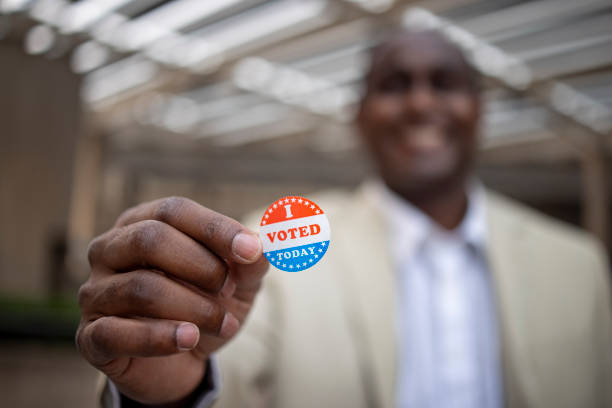 istock Young Black Man with I voted Sticker 1272135955