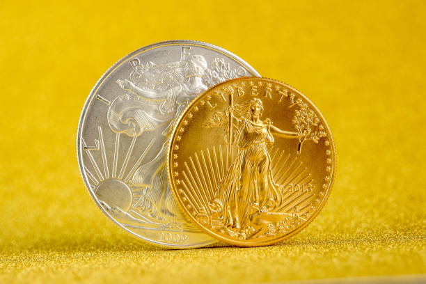 istock silver eagle and golden american eagle one ounce coins 1272137473