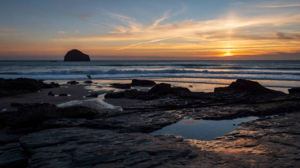 istock Silhouette of a surfer on a beach in Cornwall at sunset 1272139885