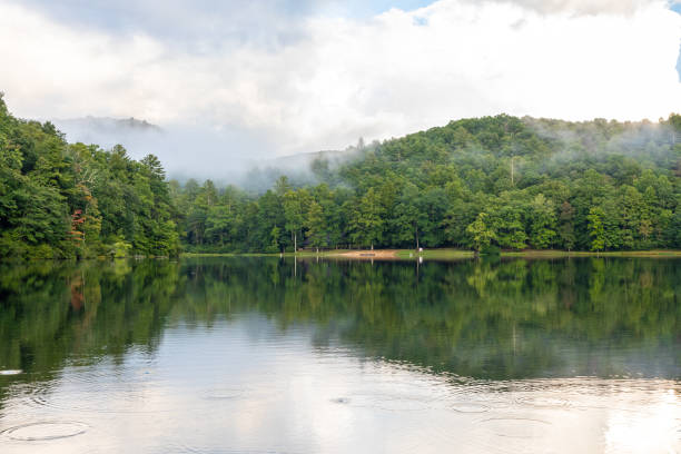 Foggy Afternoon on Lake in Georgia Mountains Fog and low clouds hang over Lake Winfield Scott near the small town of Suches in northeastern Georgia. georgia country stock pictures, royalty-free photos & images