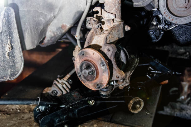 istock mechanic removes the car wheel hub. 1272142444