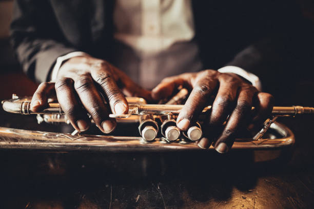 The hands of the trumpet player Trumpet, Player, vintage, dark, art, jazz, trumpet player, hand, luxury, jazz music stock pictures, royalty-free photos & images