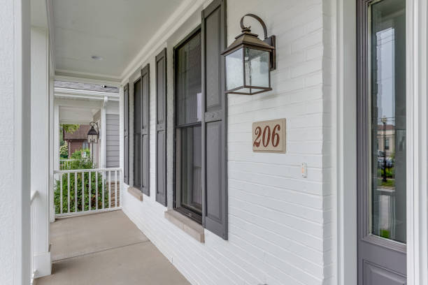 istock Lovely front porch with sconce lantern light 1272143343