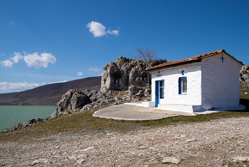 Small white church by the lakeside in Petres village, Florina, Greece