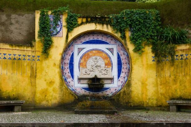 istock Water fountain on yellow wall 1272145181