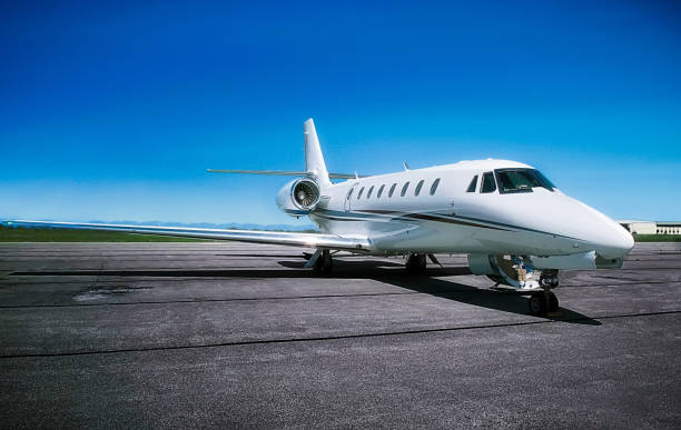 istock Private Jet with Clear Blue Skies 1272146108