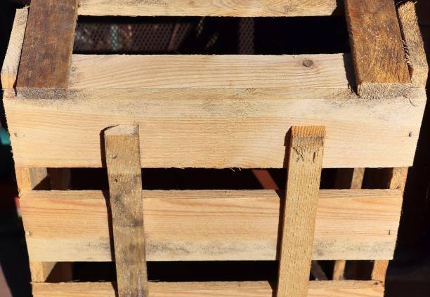 istock Very old wooden crates with some cracks in a close up view 1272146338