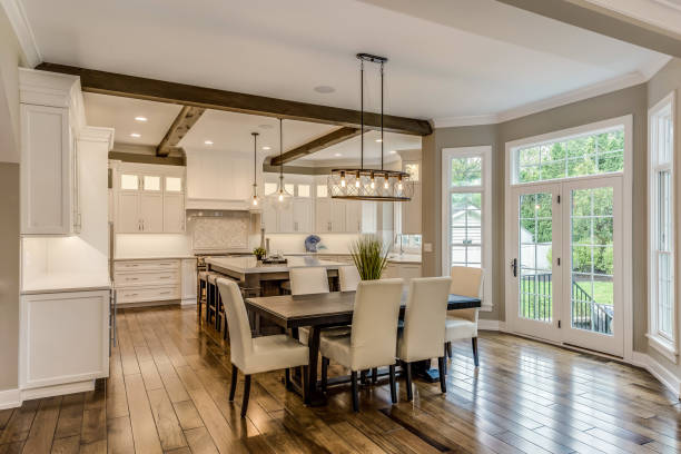 istock Wood beams on ceiling with two pendant lights hang over island 1272146893