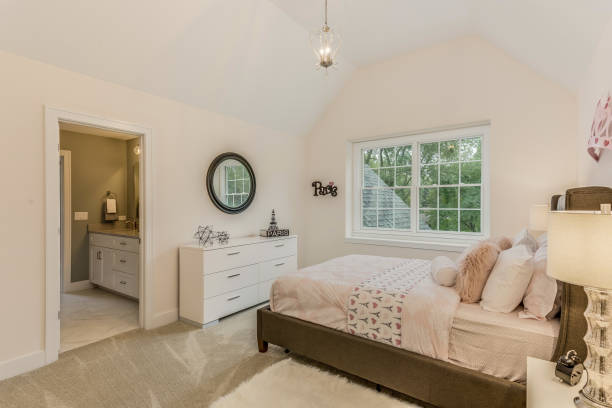 istock Bright and clean bedroom with cove style ceiling 1272146895