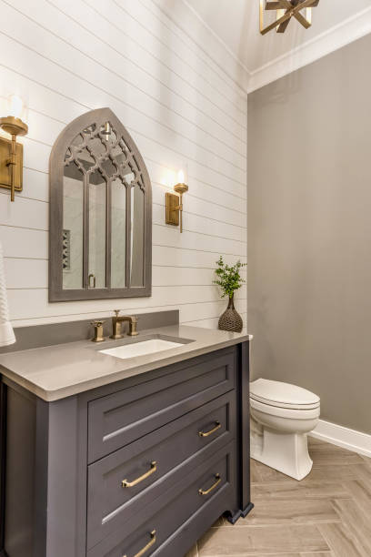 istock Beautiful ornate mirror in small bathroom 1272146915