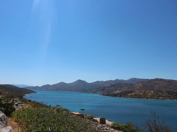 istock Blue Ocean Which Looks Like A River with Mountains in the Background - Spinalonga 1272148964