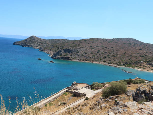 istock Ocean View from Spinalonga Island with Old Tower Walls and Blue Ocean in the Background 1272149041