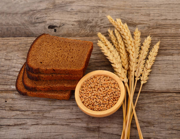 istock Wheat in a bowl, ears and bread. 1272149327
