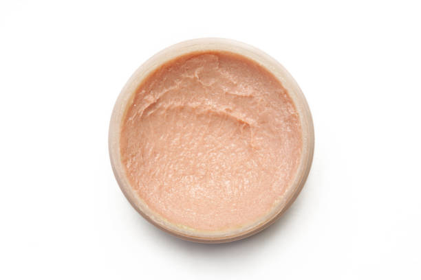 istock Liquid foundation in a container isolated on white background, top view 1272149475