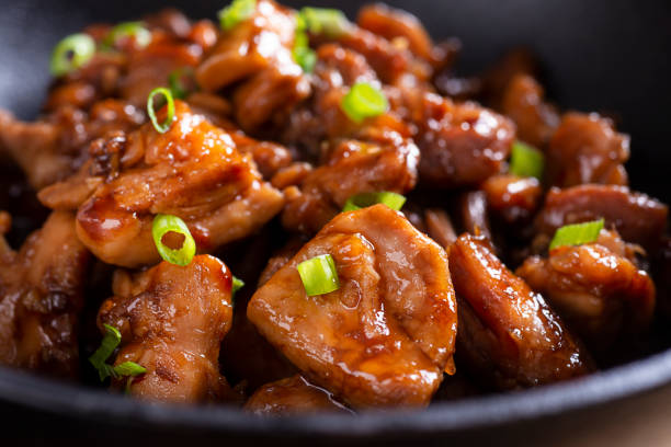 Bourbon Chicken Stir-Fried Bourbon Chicken in a Wok soy sauce photos stock pictures, royalty-free photos & images