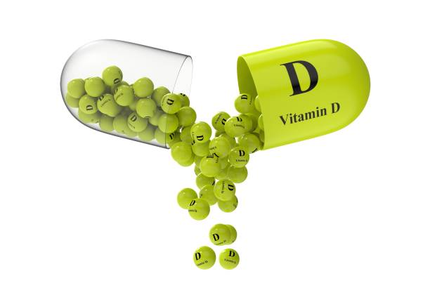 istock Open capsule with vitamin D from which the vitamin composition is pouring 1272150433