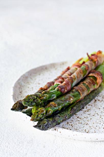 istock Ripe baked asparagus with bacon, side dish for breakfast, lunch, barbecue. 1272151458