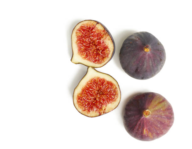 istock ripe whole and halved purple figs isolated on white background 1272158120