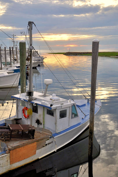 istock Cape Cod Fishing Boats Moored at Rock Harbor at Sunet 1272166300