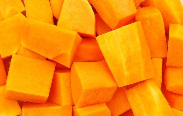 istock A group of cut and slice butternut squash chunks on  background. 1272166367