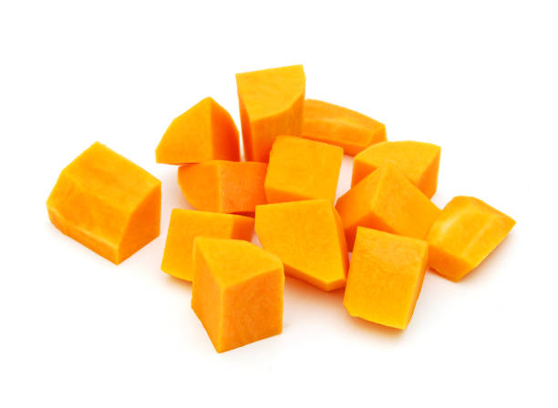 istock A group of cut and slice butternut squash chunks on a white background. 1272166447