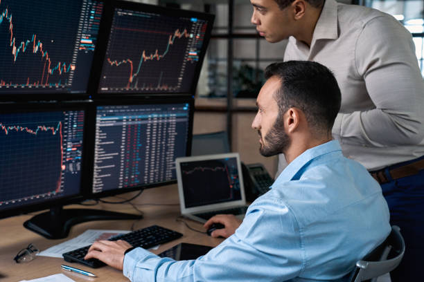 istock Two stock broker analyzing index on cryptocurrency diagram 1272168489