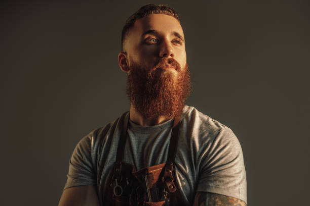 istock Confident bearded hairdresser looking away 1272168708