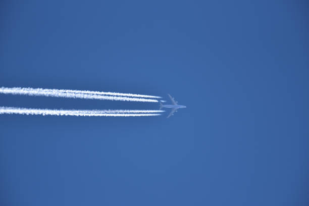 istock Jet airplane in the blue sky 1272171417