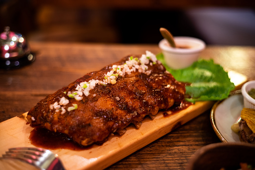 Spare ribs on a table at a Mexican restaurant.\nIndoor Table Photo. Local Mexican Cuisine.