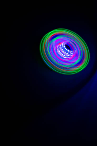 istock Long exposure photograph of a light spinning top with black background. 1272185672