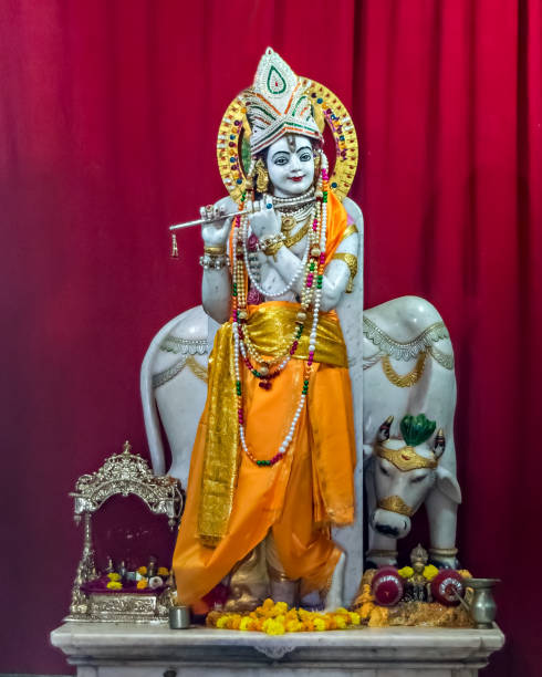 Nicely carved and decorated isolated idol of Hindu God Krisna with flute in a temple at Somnath, Gujrat, India. Nicely carved and decorated isolated idol of Hindu God Krisna with flute in a temple at Somnath, Gujrat, India. pictures of krishna stock pictures, royalty-free photos & images
