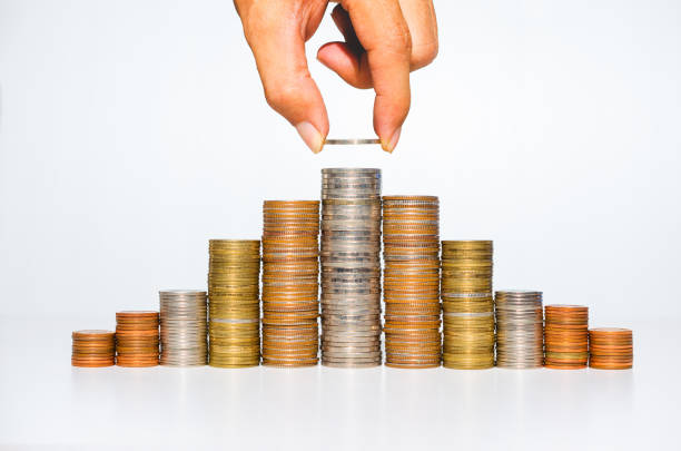 istock business man hand put coin stack growth up isolated on white background. money saving, financial growing, business startup, economy budget and investment concept. 1272187995