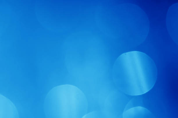 istock glitter light sparkle blue gorgeous bokeh defocused abstract background shiny. 1272187999