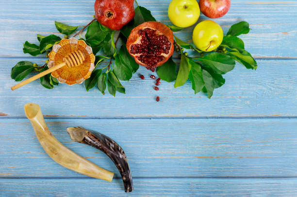 istock Shofar and honey with apple on blue background. 1272189510