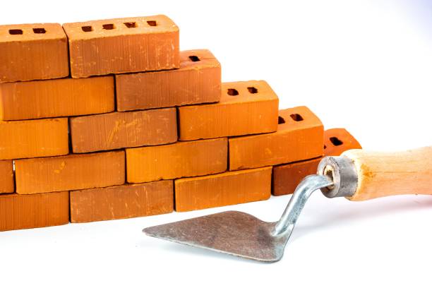 istock Masonry from brick blocks and trowel on white background 1272193012