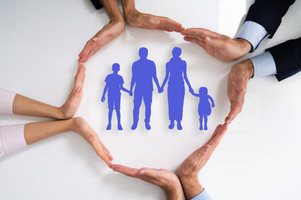 istock Diverse Group Of People Protecting Family 1272197492