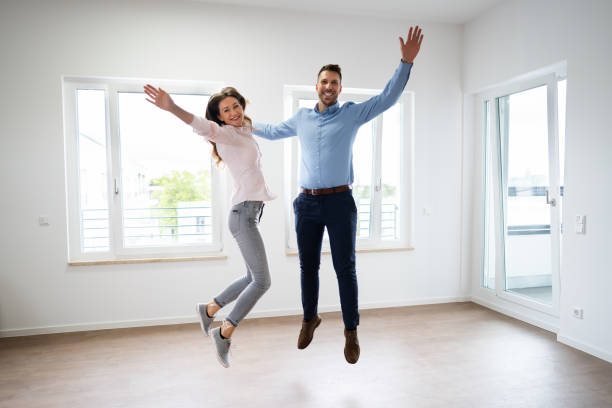 istock Happy Family Jumping Moving 1272197728