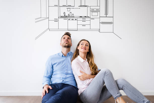 istock Couple Thinking To Buy New Kitchen For House 1272197733