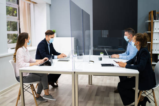 istock Face Mask Office Social Distancing Meeting 1272197855