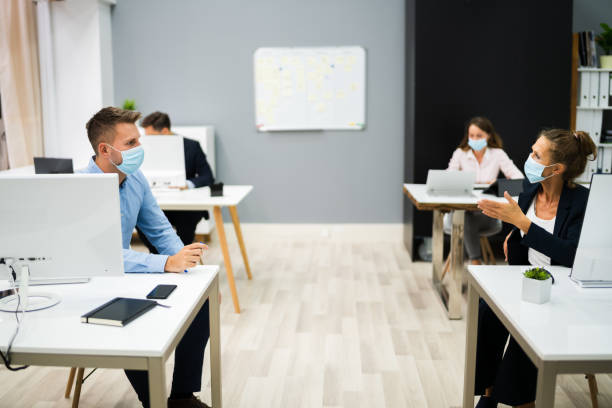istock Business People Talking With Social Distancing 1272198436