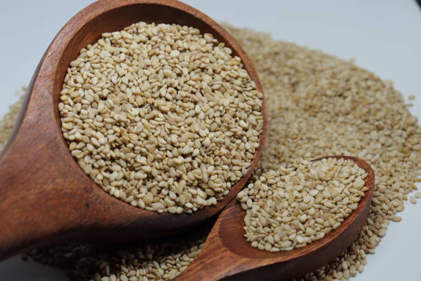 istock Organic natural Til Gul OR Sesame seeds over white background 1272199724