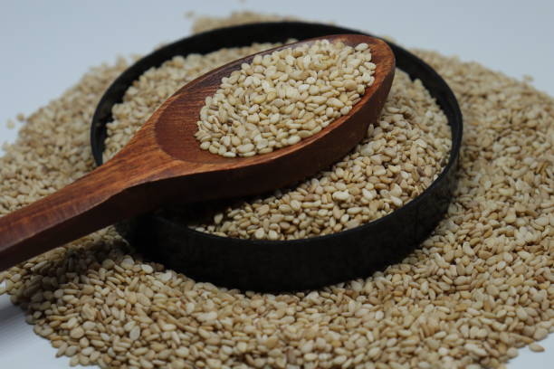 istock Organic natural Til Gul OR Sesame seeds over white background 1272200312