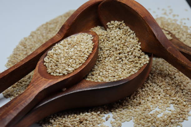 istock Organic natural Til Gul OR Sesame seeds over white background 1272200521
